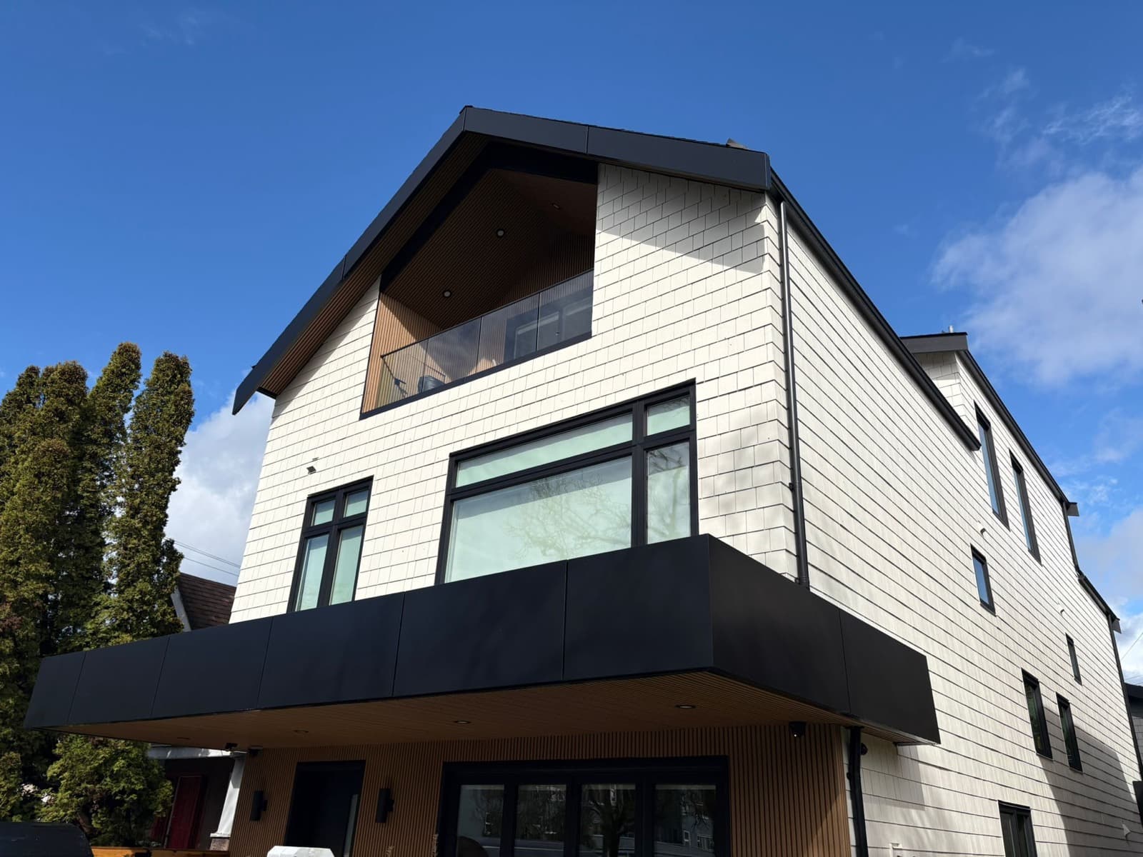 New Hardishake siding and cedar soffit, completed